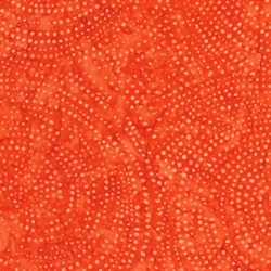 rødt batikstof til patchwork med spiralmotiv