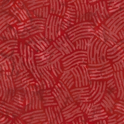 rødt patchworkstof med batiktryk